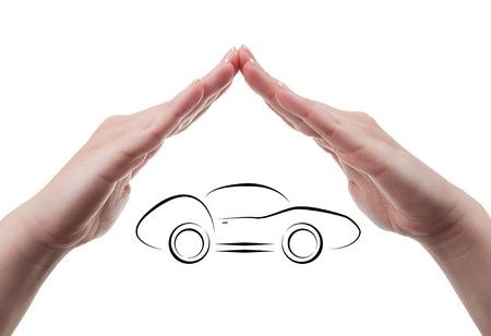 29035417 - two hands protecting a sport car vehicle insurance concept isolated on white background