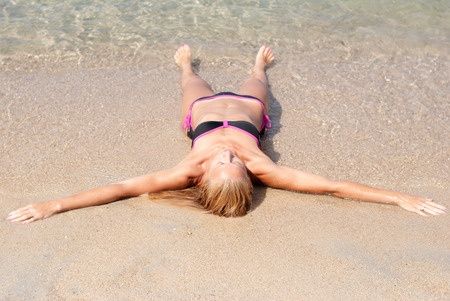 30484630 - beautiful young woman relaxing at beach